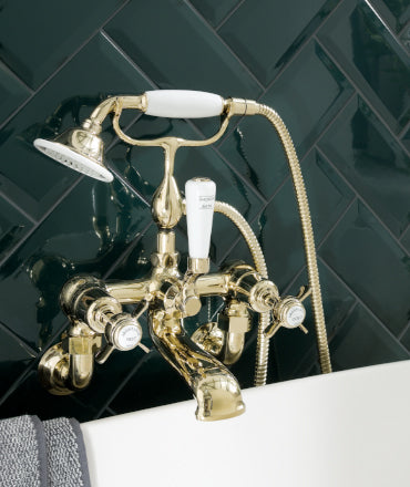 Gold wall mounted bath tap with shower