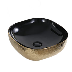 Countertop basin gloss gold exterior and gloss black interior