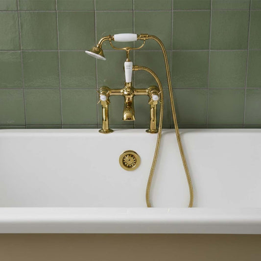Victorian style gold bath tap with shower - deck mounted 