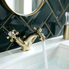 shinny gold deck mounted wash basin taps