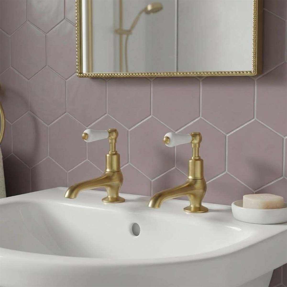 traditional brushed brass basin pillar taps with white ceramic handles and long nose 