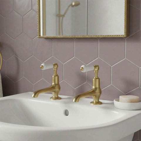 traditional brushed brass basin pillar taps with white ceramic handles and long nose 